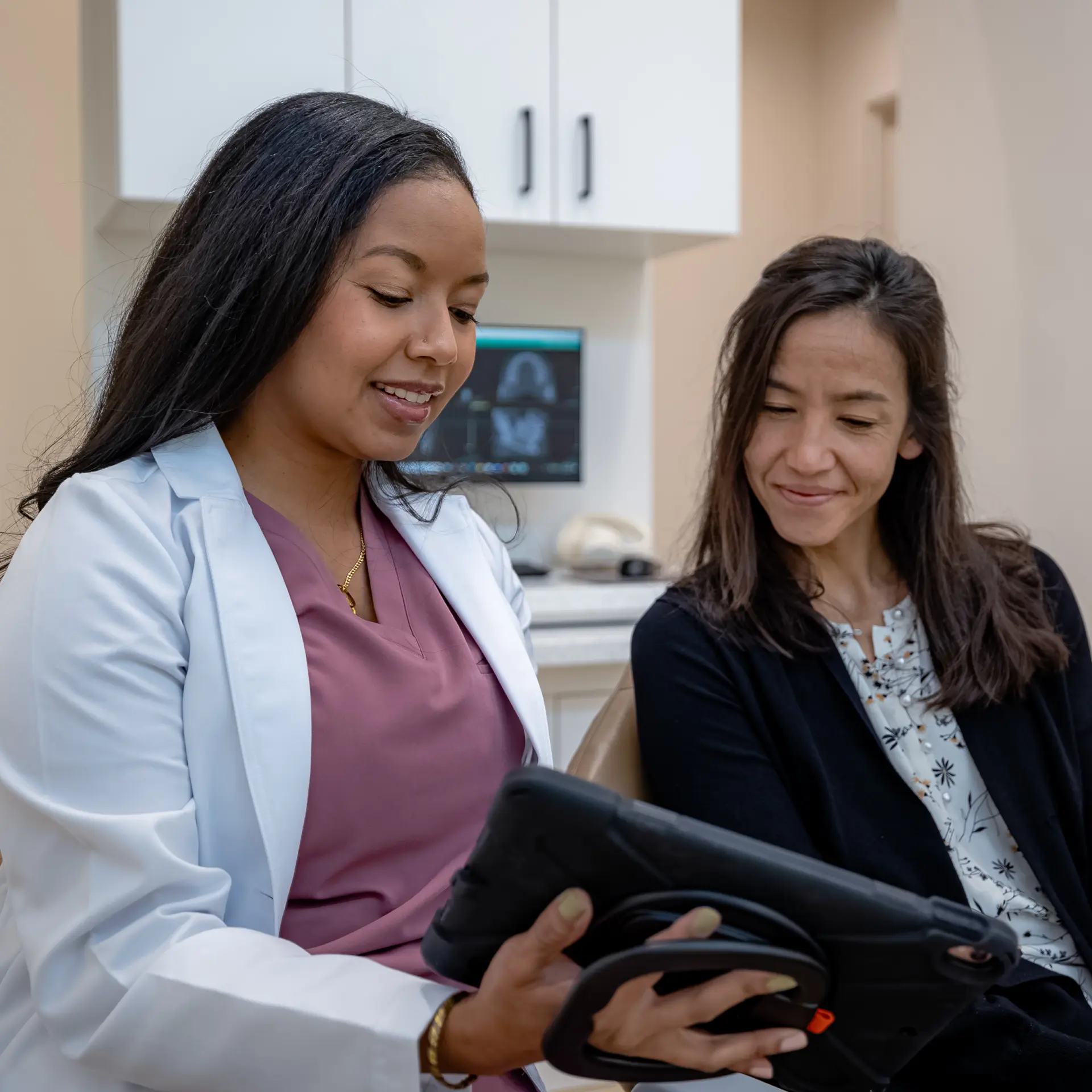 Doctor communicating with a patient and showing her results