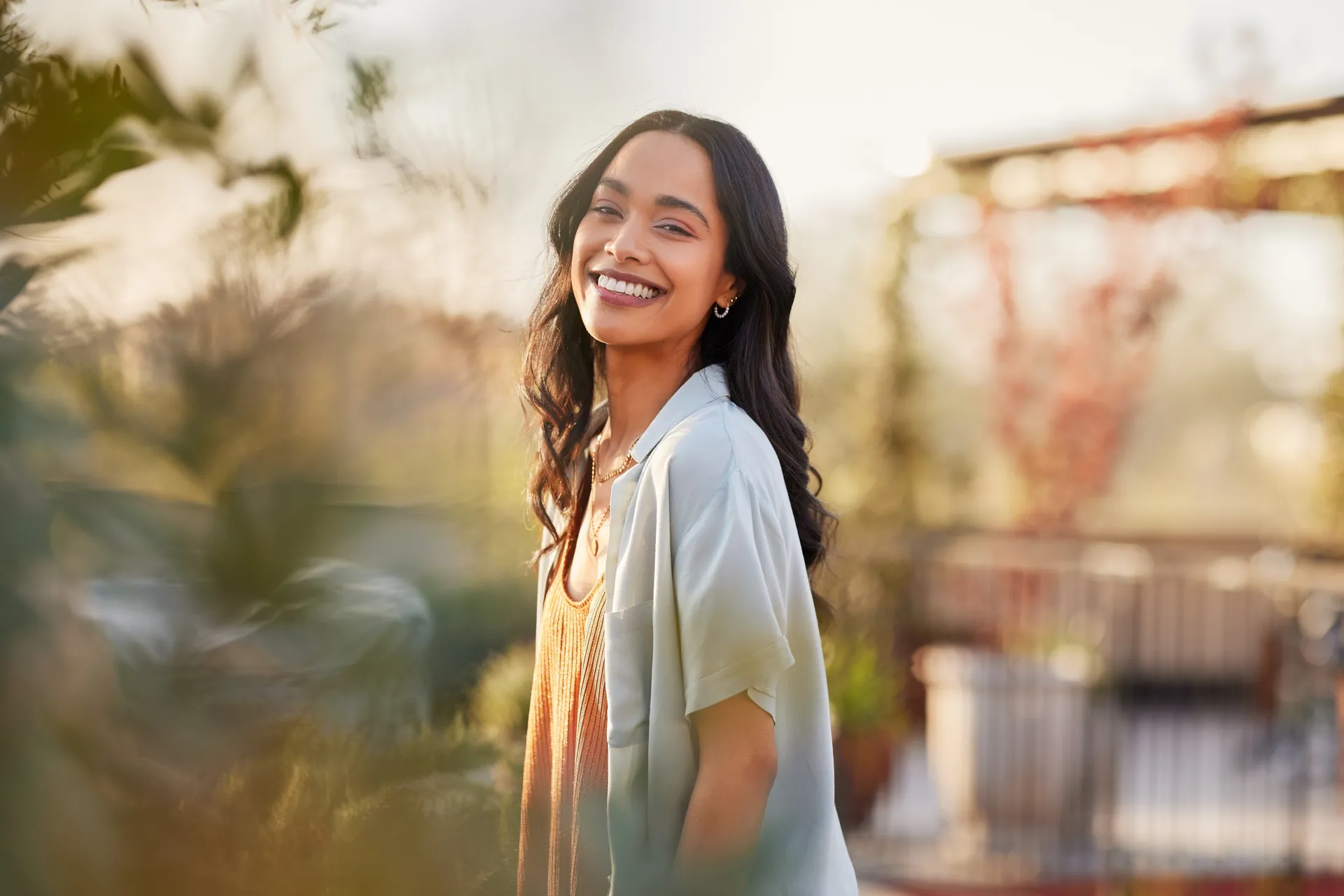 girl smiling outside in a patio